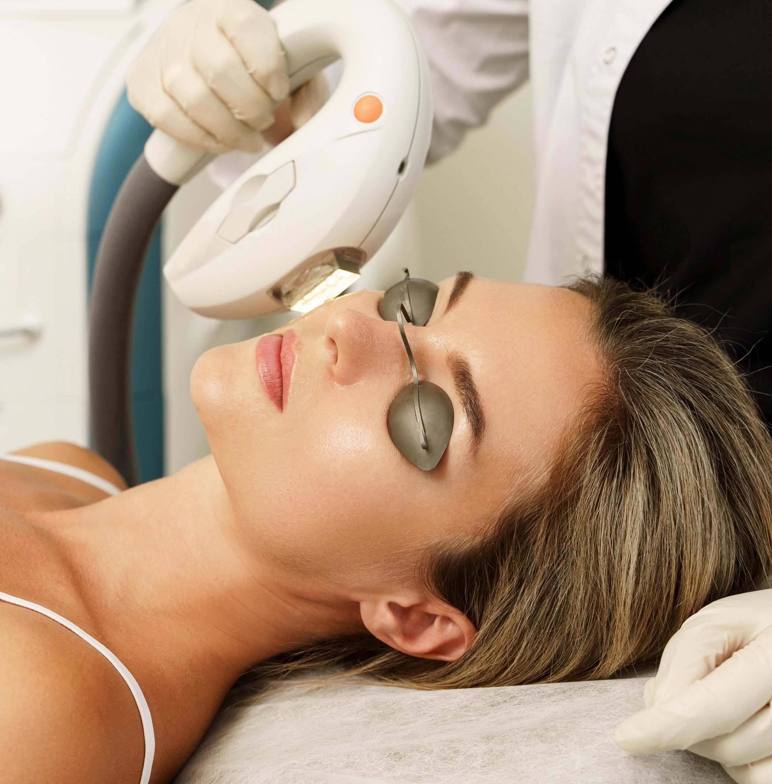 Woman client during IPL treatment in a cosmetology clinic